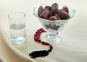 Dates, water and prayer beads
